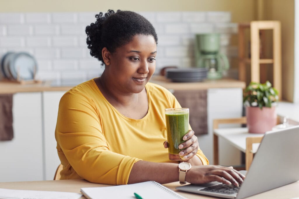 Overweight Woman Drinking Smoothie